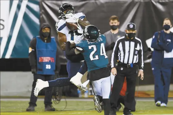  ?? AP photos ?? Seahawks receiver DK Metcalf catches a pass as the Eagles’ Darius Slay defends during the second half of Seattle’s 23-17 win Monday