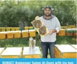  ?? ?? KUWAIT: Beekeeper Salem Al-Oumi with his beehives. — KUNA photos