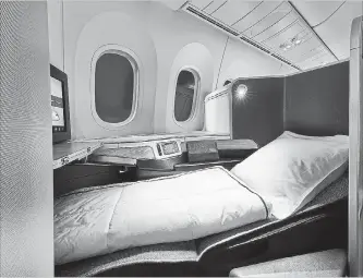  ?? THE CANADIAN PRESS ?? Air Canada's internatio­nal business class cabin on the 787 Dreamliner. The airline will be offering lie-flat seats on some North American routes as of June 1.