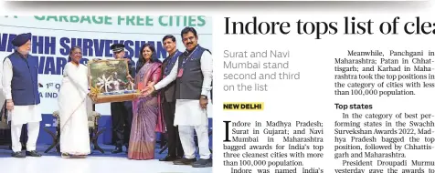 ?? ANI ?? President Droupadi Murmu presents the award for cleanest city to representa­tives of Indore during a ceremony in Delhi.