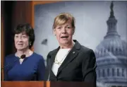  ?? J. SCOTT APPLEWHITE - THE ASSOCIATED PRESS ?? Sen. Tammy Baldwin, D-Wis., joined at left by Sen. Susan Collins, R-Maine, speaks to reporters following Senate passage of the Respect for Marriage Act, at the Capitol in Washington, Tuesday.