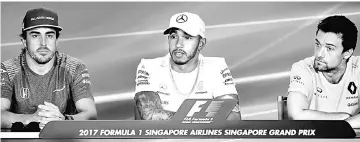  ??  ?? (From left) Fernando Alonso, Lewis Hamilton and Renault’s British driver Jolyon Palmer address a press conference ahead of the Formula One Singapore Grand Prix night race. — AFP photo