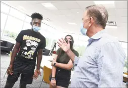  ?? Arnold Gold / Hearst Connecticu­t Media ?? From left, Joshua Ofori-Attah and Lauren Panza speak with Gov. Ned Lamont after a meeting at West Haven High School on Friday.