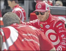  ?? CHUCK BURTON / ASSOCIATED PRESS ?? Kyle Larson talks to a crew member before practice for Sunday’s Coca-Cola 600. Larson, 23, appears to be closing in on his first Sprint Cup win with improving finishes.