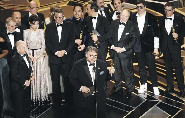  ?? CHRIS PIZZELLO/THE ASSOCIATED PRESS ?? Director Guillermo del Toro and the cast and crew of The Shape of Water accept the award for best picture at the Oscars on Sunday at the Dolby Theatre in Los Angeles. The film was shot in and around Toronto and Hamilton, Ont.