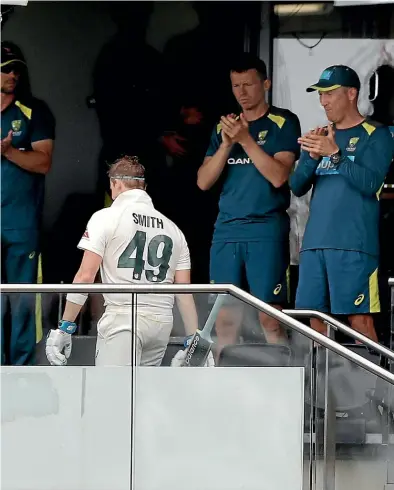  ?? GETTY IMAGES ?? Steve Smith, of Australia, leaves the field after being dismissed for 142 during day four of the Ashes test against England at Edgbaston. Inset: Smith is presented with the player of the match award.