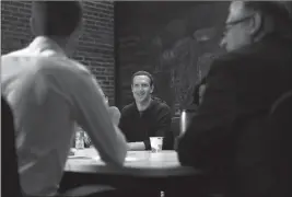  ?? ASSOCIATED PRESS ?? FACEBOOK CEO MARK ZUCKERBERG meets with a group of entreprene­urs and innovators during a roundtable discussion at Cortex Innovation Community technology hub Thursday in St. Louis. Zuckerberg was in St. Louis to announce a program to boost small...