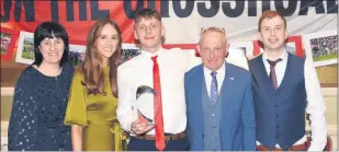  ?? Sheehan) (Pic: Catherine ?? Ballygibli­n GAA player, Joseph O’Sullivan, joint winner of the ‘Hurler of the Year’, pictured with his family - Tina, Sinead, Joe, and Sean O’Dwyer at the victory social.