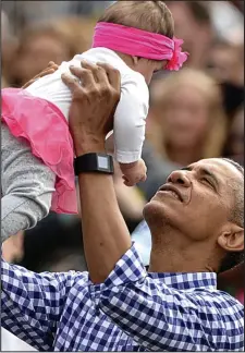  ??  ?? Yards away: President Obama greets families for Easter