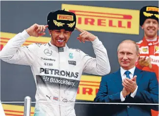  ?? PHOTO: GETTY IMAGES ?? Lewis Hamilton celebrates his Russian GP win as Russian president Vladimir Putin looks on.