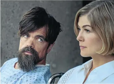  ?? Picture: Nexflix ?? Peter Dinklage as Russian mobster Roman, and Rosamund Pike as Marla Grayson.