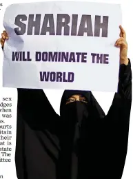  ??  ?? HARDLINE: A Muslim woman campaignin­g for sharia law in London