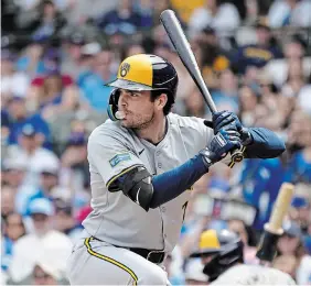  ?? ?? Milwaukee Brewers first baseman Tyler Black blows a bubble as he wait for a pitch from Chicago Cubs pitcher Jameson Taillon during a game on Saturday.