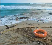  ?? ALESSANDRO SERRANO/GETTY-AFP ?? Debris from a wooden boat washes ashore Sunday off Italy’s southern Calabria region.