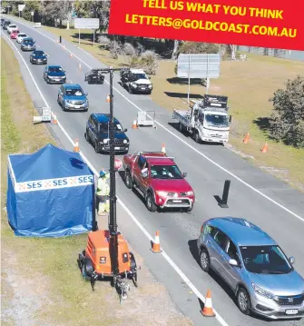  ?? Picture: SCOTT POWICK ?? Police are being assisted by the army and SES to weed out virus hotspot arrivals.