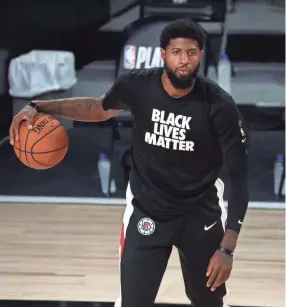  ?? KIM KLEMENT/USA TODAY SPORTS ?? Clippers guard Paul George warms up before Game 5 of a first-round playoff series against the Mavericks on Tuesday.