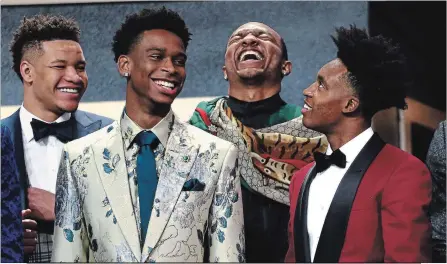  ?? MIKE STOBE GETTY IMAGES ?? Kevin Knox, left, Shai Gilgeous-Alexander, Wendell Carter Jr. and Collin Sexton before the draft. Gilgeous-Alexander was noted for his natty suit.