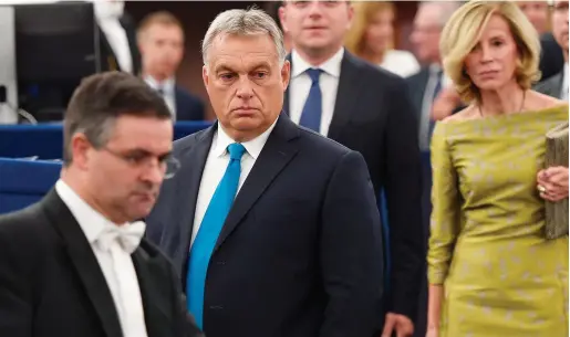  ?? Photo: Frederick Florin/AFP ?? Criticism: Viktor Orban (centre) arrives for a debate on Hungary’s situation at the European Parliament in Strasbourg.