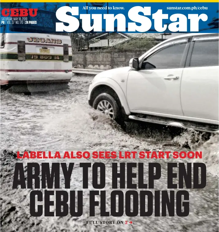  ??  ?? VIGOROUS POLICY. Amid an El Niño-wracked summer plagued by water shortages in some parts of the city, heavy rain suddenly floods parts of the highway at the South Road Properties in Cebu City on Friday, May 17, 2019, causing traffic. Cebu City Mayor-Elect Edgardo Labella says a massive dredging of rivers and a vigorous policy against throwing trash into waterways will help prevent floods.