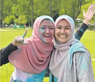  ??  ?? Fun form of exercise . . . Aqilah Pauzi (left) and Jasmin Ramli enjoyed the event.