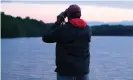  ?? Photograph: Victoria Bekiempis ?? watch over a New Jersey lake.