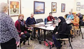  ?? [PHOTO PROVIDED] ?? Case managers teach newly arrived refugees the basics of the American culture, the basics of transporta­tion, housing, education and budgeting.