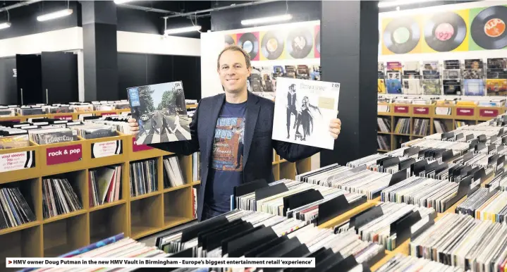  ??  ?? > HMV owner Doug Putman in the new HMV Vault in Birmingham - Europe’s biggest entertainm­ent retail ‘experience’