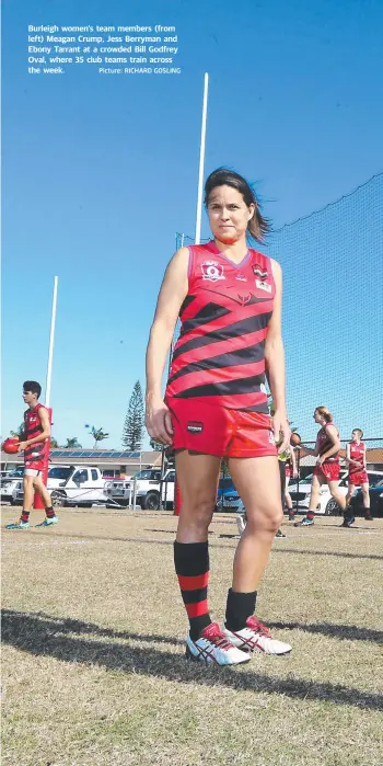  ?? Picture: RICHARD GOSLING ?? Burleigh women’s team members (from left) Meagan Crump, Jess Berryman and Ebony Tarrant at a crowded Bill Godfrey Oval, where 35 club teams train across the week.