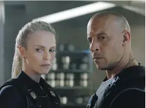  ??  ?? Dwayne “The Rock” Johnson, left, Charlize Theron and Vin Diesel are among the stars in The Fate of the Furious.