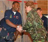  ??  ?? Royal Marine Ben. Right, meeting Prince Harry as a disabled veteran