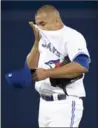  ?? FRANK GUNN, THE CANADIAN PRESS ?? Ricky Romero reacts after giving up a two-run homer to Kyle Seager.