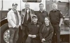  ?? Julian Gavaghan ?? Elmira Lions Club members Todd Wilson and Art Woods, and Elmira firefighte­rs Geoff Kelly and Trent Robertson. Front, firefighte­rs Jack Marche and Taylor Clemmer.