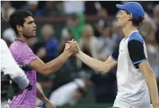  ?? EPA ?? Carlos Alcaraz, left, after beating Jannik Sinner 1-6, 6-3, 6-2 in their semi-final clash at Indian Wells on Saturday