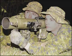  ?? Joey smiTh/Truro Daily News ?? Cpl. Gavin Hamilton, left, and Cpl. Robert Weatherby, practise loading and unloading drills on an 84mm Carl Gustav recoilless rifle during Nova Scotia Highlander­s reserves training at the Truro Armouries. This Saturday, the Canadian Army Reserves will...