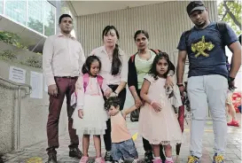  ?? AP ?? The asylum seekers who sheltered Edward Snowden four years ago in Hong Kong, from left: Ajith Pushpa Kumara, Vanessa Mae Rodel and her daughter, Keana, Nadeeka Dilrukshi Nonis and her son, Dinath, and daughter, Sethmundi Kellapatha, and Supun Thilina...