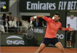  ?? THIBAULT CAMUS – THE ASSOCIATED PRESS ?? Novak Djokovic plays a shot during his second-round victory over Marton Fucsovics.