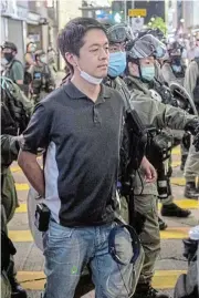  ?? /Bloomberg ?? Fresh start: Ted Hui is arrested during a 2019 protest in the Causeway Bay district of Hong Kong.