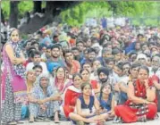  ?? RAVI KUMAR/HT PHOTO ?? Dera followers wait outside the CBI court in Panchkula on Friday.