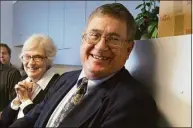  ?? Douglas Healey / Associated Press ?? Associated Press photograph­er Bob Child and his wife, Joan Child, celebrate as he is recognized for his 35 years of service with the AP in Hartford, on Feb. 22, 2007.