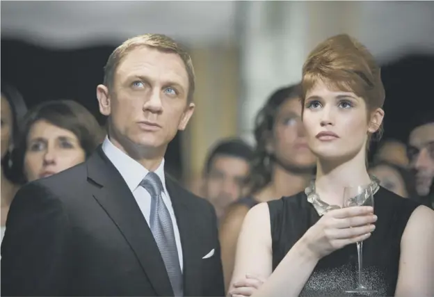  ??  ?? 0 Charismati­c and confident… James Bond actor Daniel Craig seen with Gemma Arterton in a scene from the blockbuste­r film Quantum Of Solace