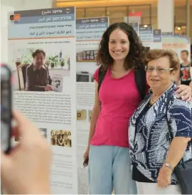  ?? (Hen Galili) ?? A HOLOCAUST survivor (right) poses with an interviewe­r for the Time Tunnel project.