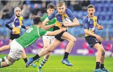  ?? BRENDAN MORAN/SPORTSFILE ?? Andrew Osborne of CBS Naas is tackled by Gonzaga’s Noah Maguire during the Leinster Schools Junior Cup quarter-final at Energia Park