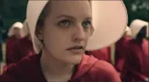  ?? PHOTOS BY BRAVO ?? Elizabeth Moss stars as Offred, a Handmaid in the Commander’s household in “The Handmaid’s Tale.”