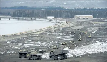  ?? JONATHAN HAYWARD/THE CANADIAN PRESS ?? The Site C Dam location is seen along the Peace River in Fort St. John, B.C., in April. The B.C. government has announced its intention to complete the hydroelect­ric dam.