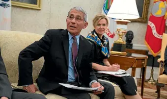  ?? AP ?? White House coronaviru­s response coordinato­r Dr Deborah Birx listens as director of the National Institute of Allergy and Infectious Diseases Dr Anthony Fauci speaks during a meeting between President Donald Trump.