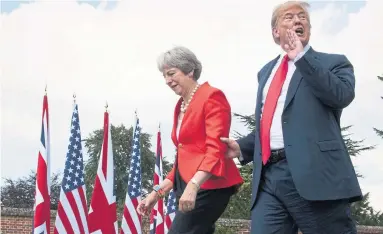  ?? STEFAN ROUSSEAU/THE ASSOCIATED PRESS ?? U.S President Donald Trump made comments smearing immigratio­n at a joint press conference with U.K. Prime Minister Theresa May in Buckingham­shire, England.