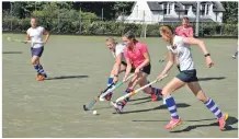  ?? 01_B38hockey0­4 ?? Elyse Aitken charges down the pitch with opposition players in hot pursuit.