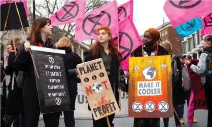  ??  ?? ‘There’s no influencer­s or celebritie­s when you are shopping second-hand. No must-haves, no weekly drops’ … Extinction Rebellion outside London fashion week earlier this year. Photograph: Katie Collins/PA