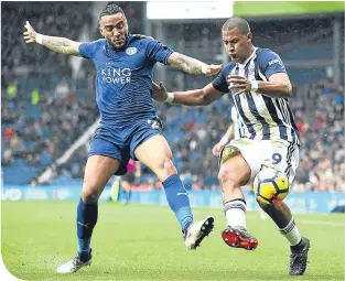  ??  ?? Leicester full-back Danny Simpson denies West Brom’s Salomon Rondon