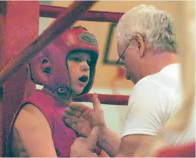  ?? CITIZEN FILE PHOTO ?? Twelve-year-old Tanner McBryan from the Spruce Capital boxing Club listens to coach Wayne Sponagle during his very first fight at the Connaught Youth Centre during an event in April 2007.